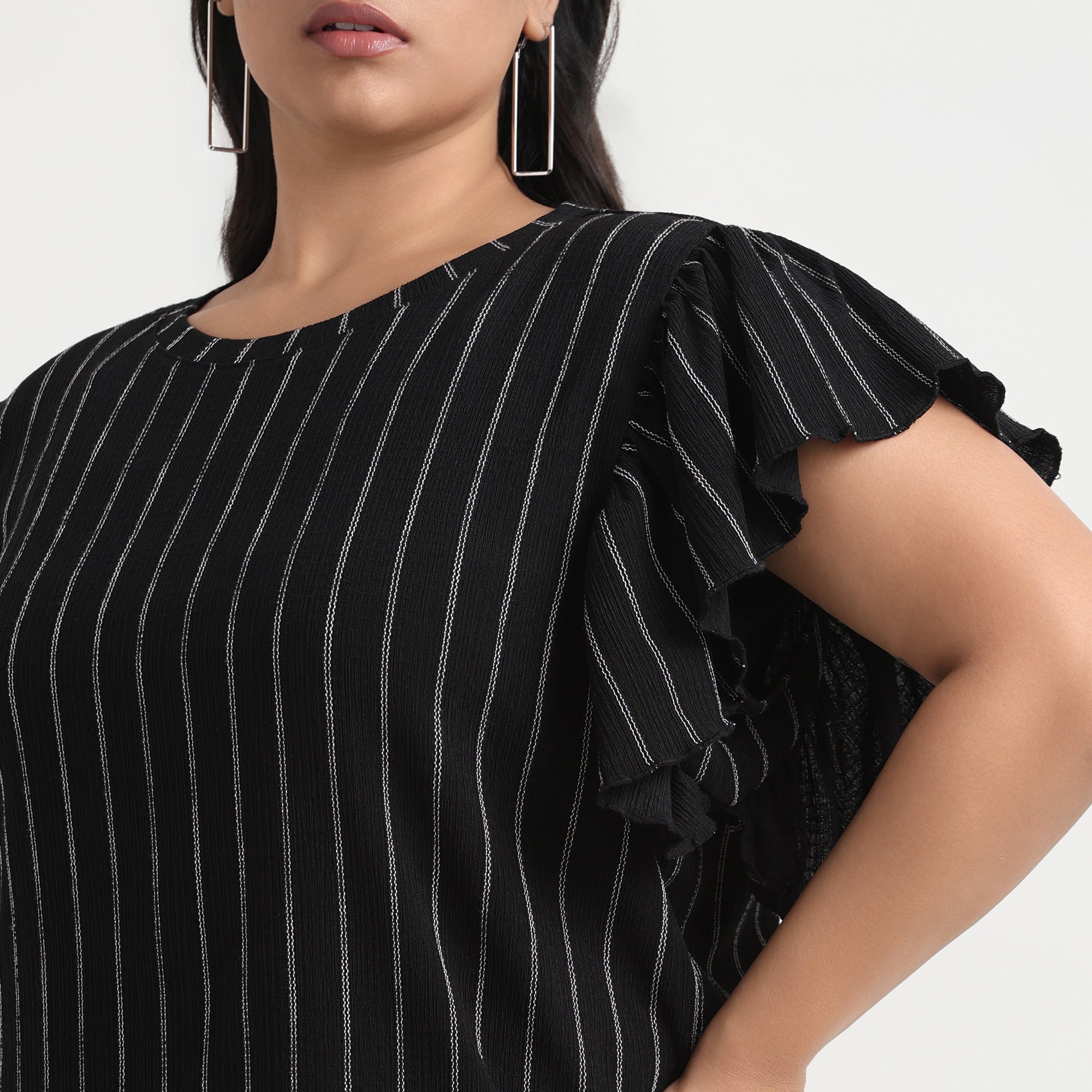 Black textured striped top with a modern, chic look, designed for plus sizes.
