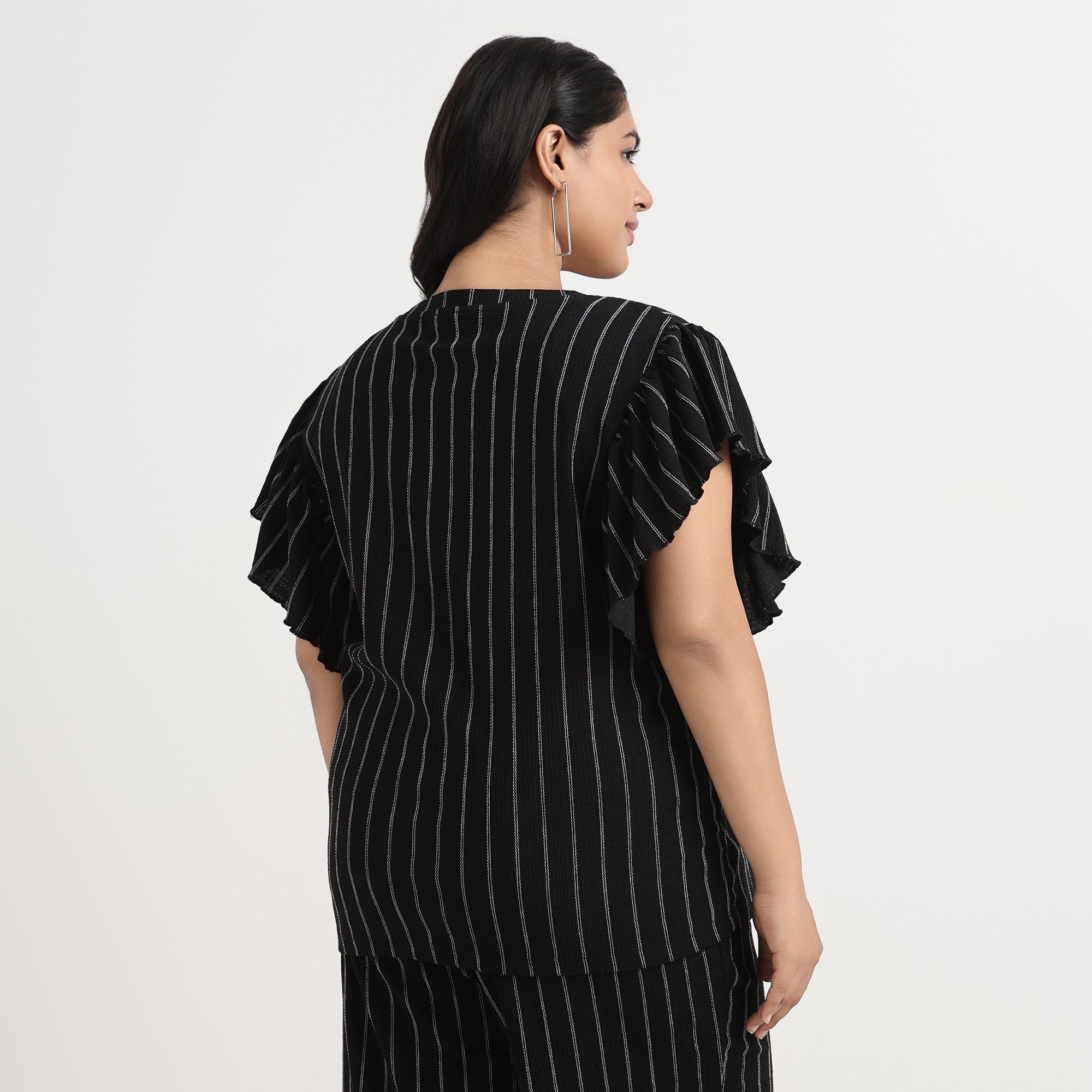 Textured black striped top back view, stylish plus size wear
