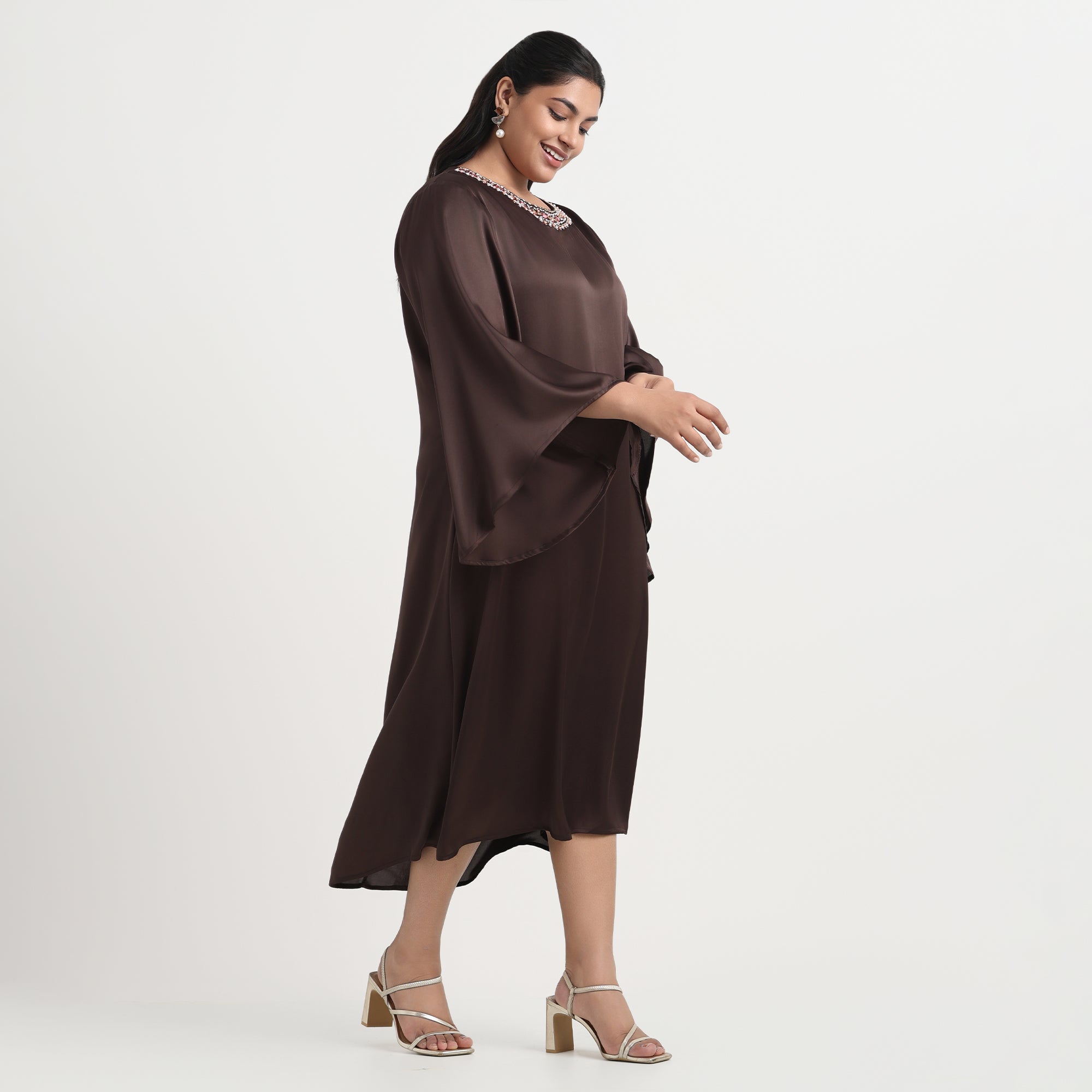 Brown satin dress with a smooth, lustrous finish and an A-line cut.
