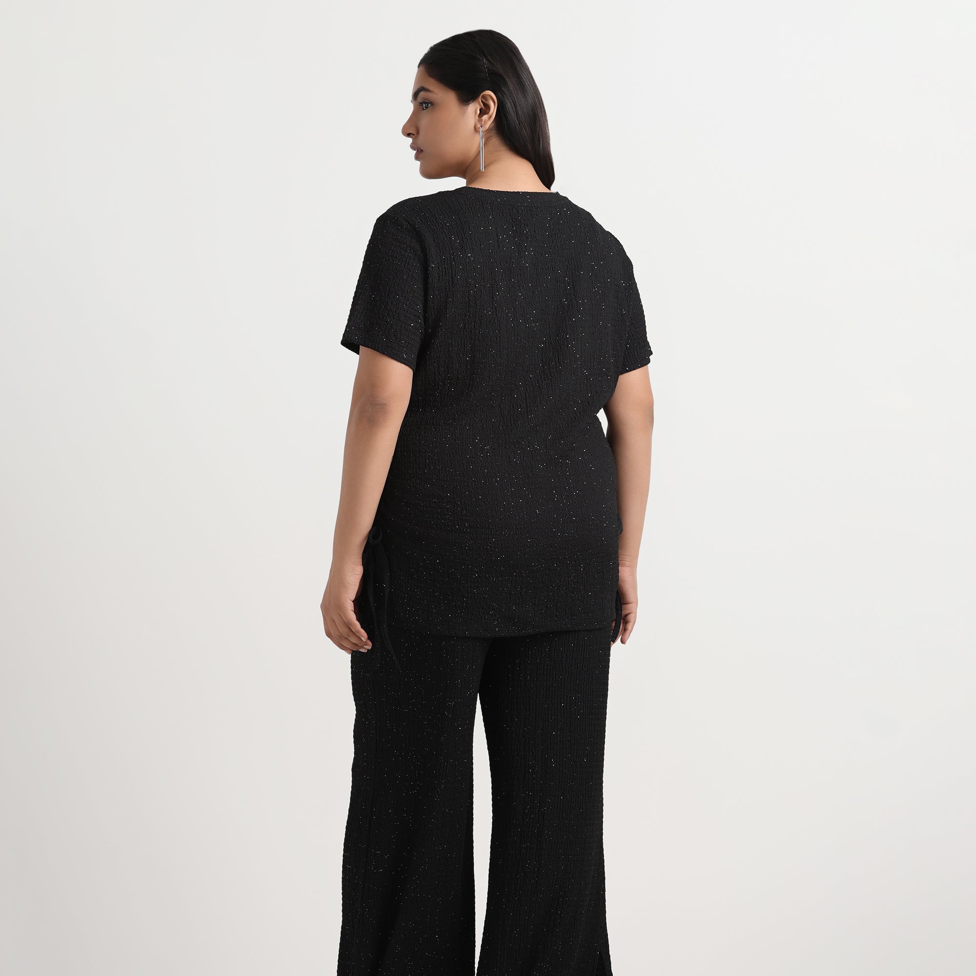 Image showcasing Backside of  Women wearing Black Knit Top