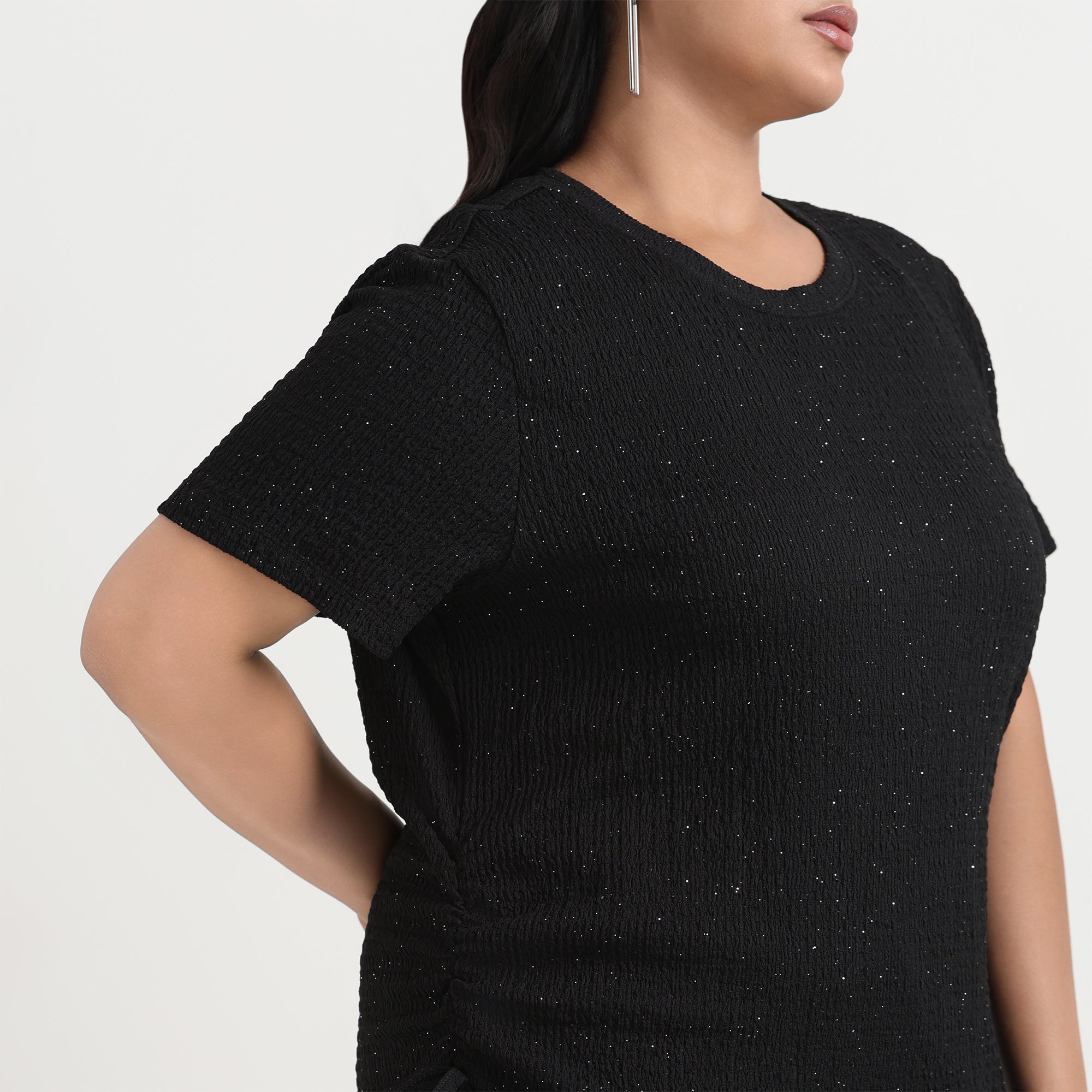 Image showcasing close up shot of women in black knit top