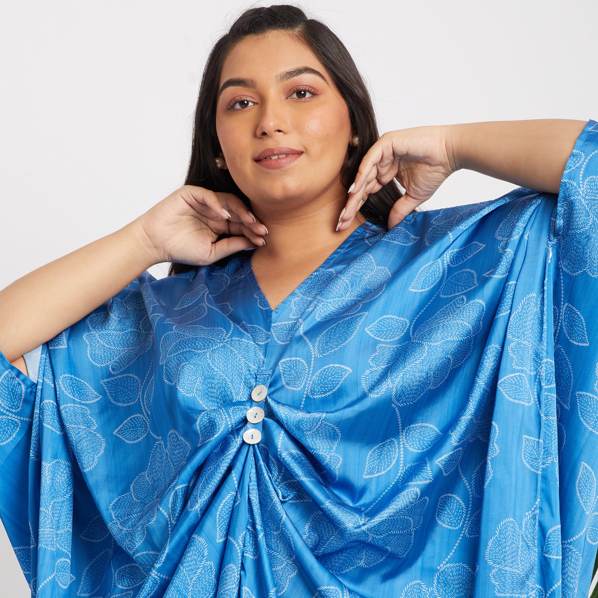 Image showcasing close up shot of women in blue kaftan dress