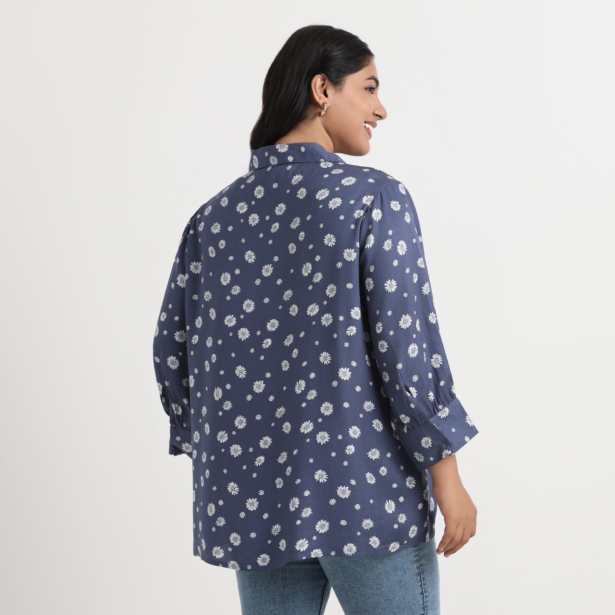 Daisy print shirt with a soft pastel design and a comfortable, relaxed fit.
