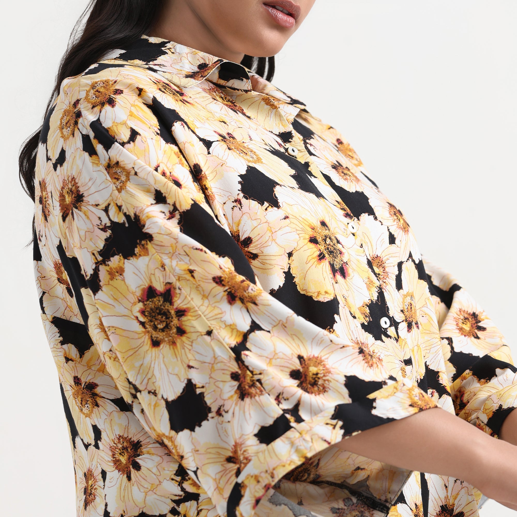 Light floral print shirt with delicate patterns and comfortable, flowing sleeves.
