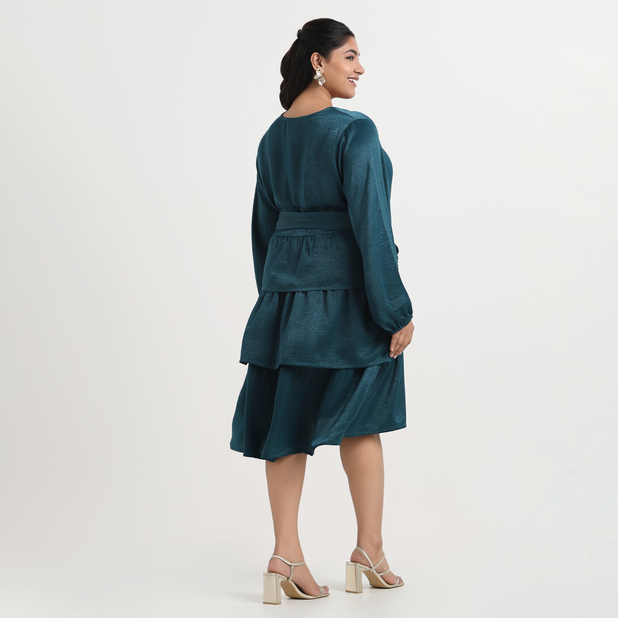 Green velvet satin dress with a soft luster, designed for a flattering plus-size fit.
