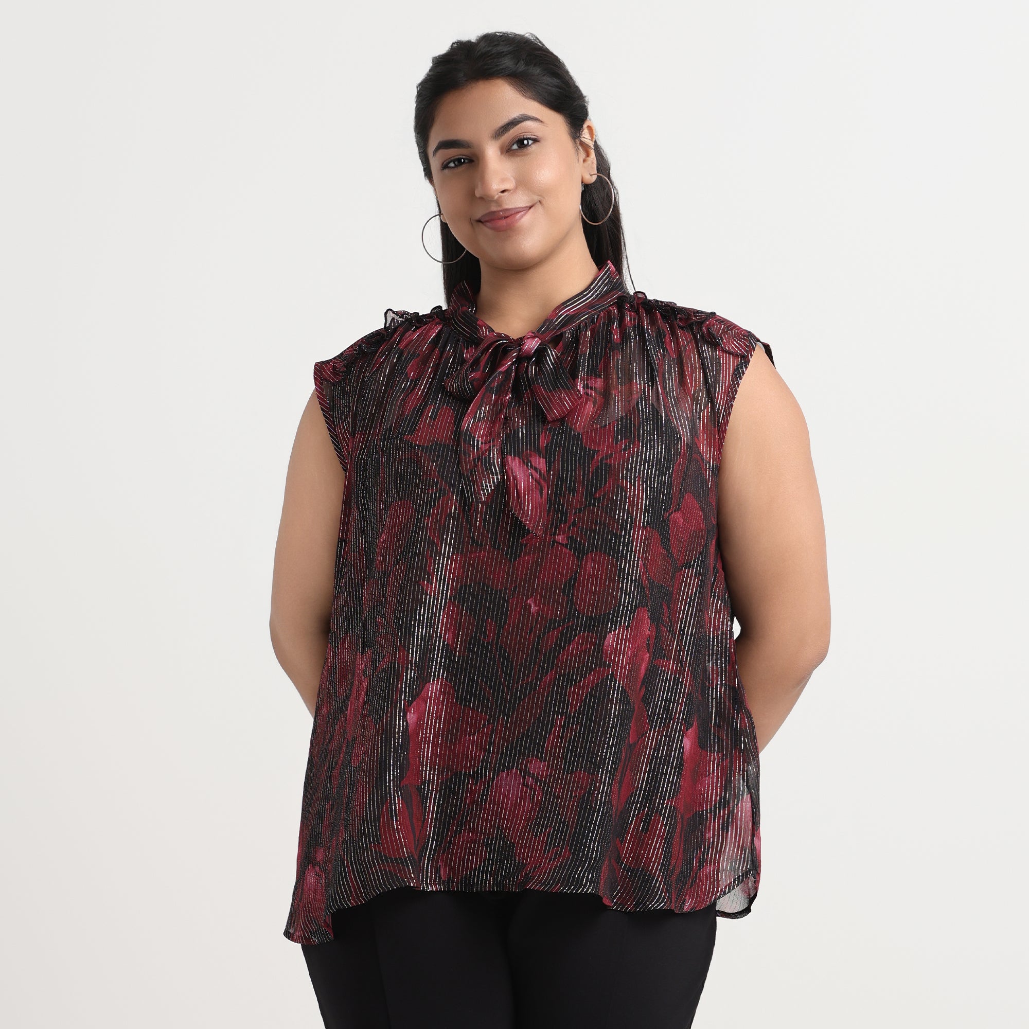 Red tie-up top with a flattering neckline and soft, breathable fabric.
