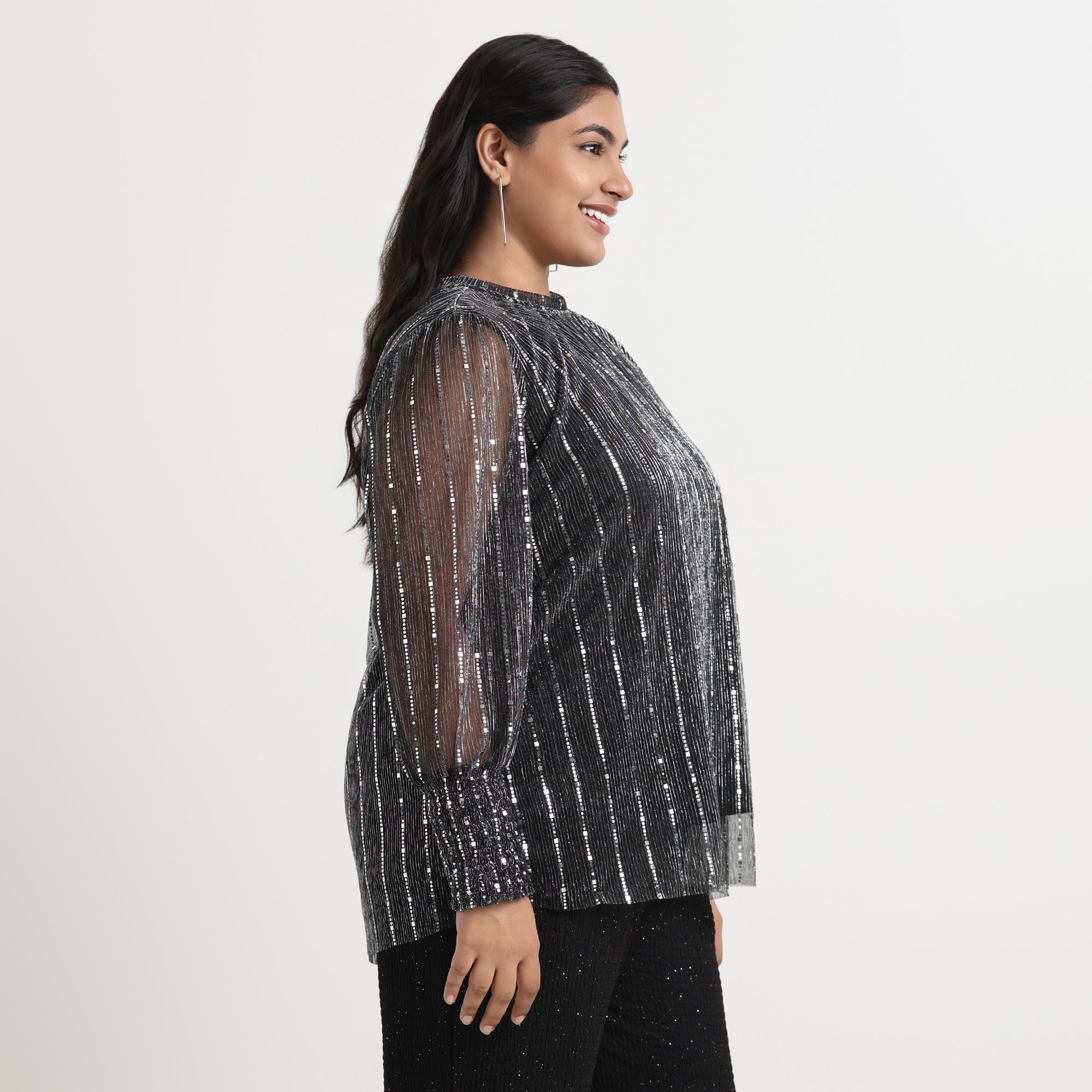 Silver plissé top with a shimmering texture and an elegant, relaxed fit.
