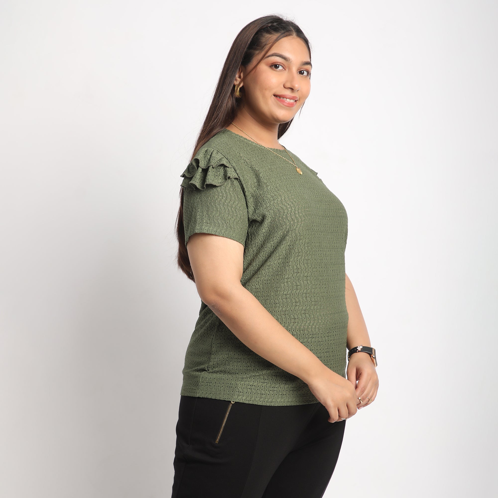 Image showcasing Side profile of women in Green Knit Top