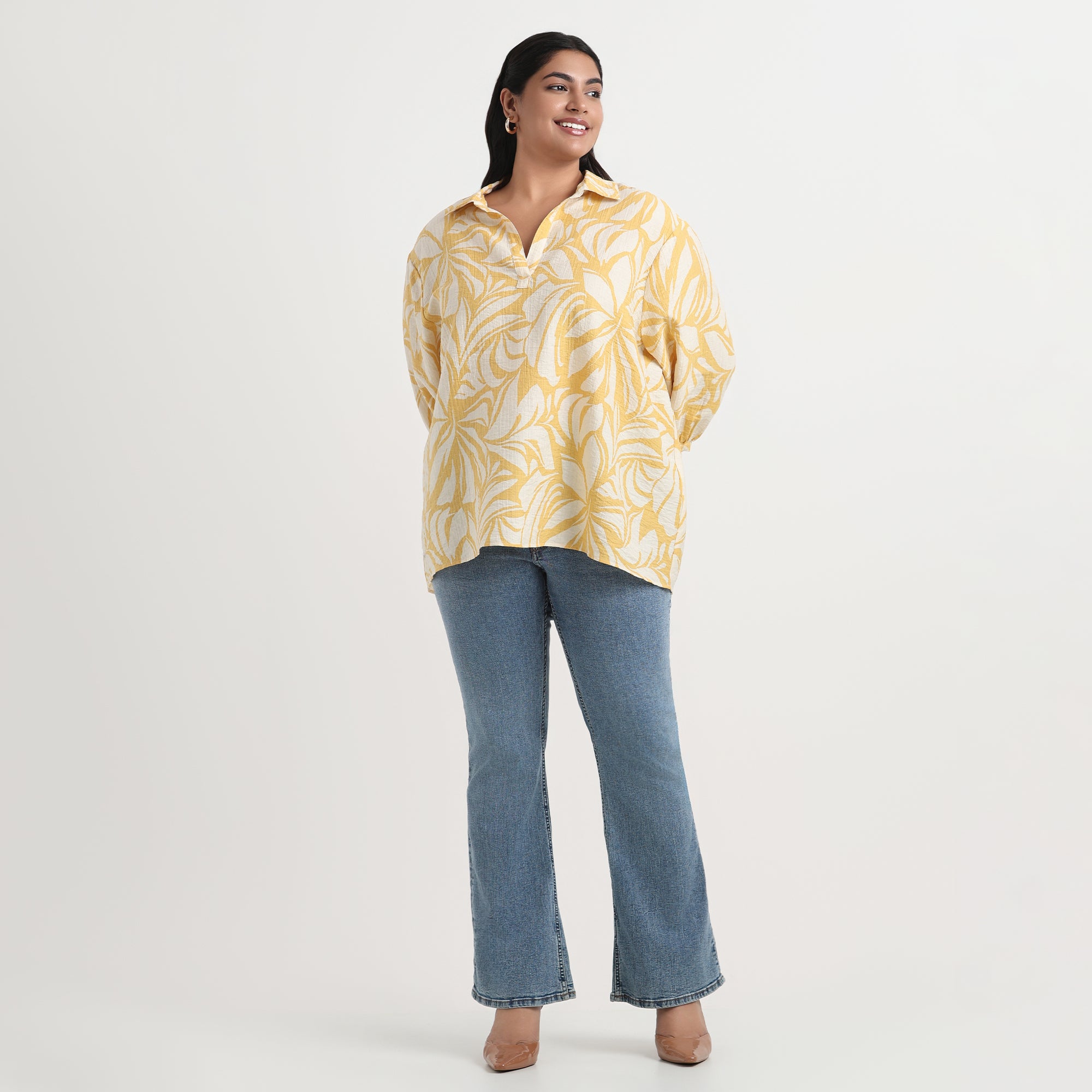 Yellow printed shirt with a vibrant pattern, long sleeves, and relaxed fit.
