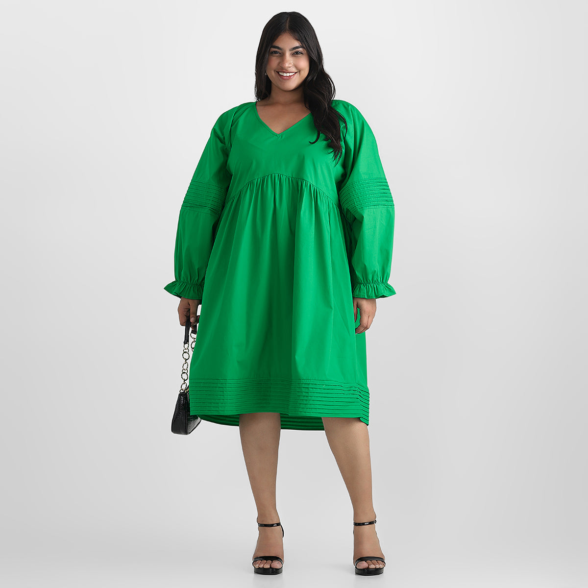 Image showcasing women wear green mid-lenght dress